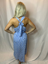 Floral dress with wrap slit.